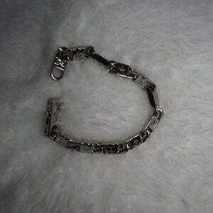 Louis Vuitton Monogram Chain Bracelet in silver-color hardware.